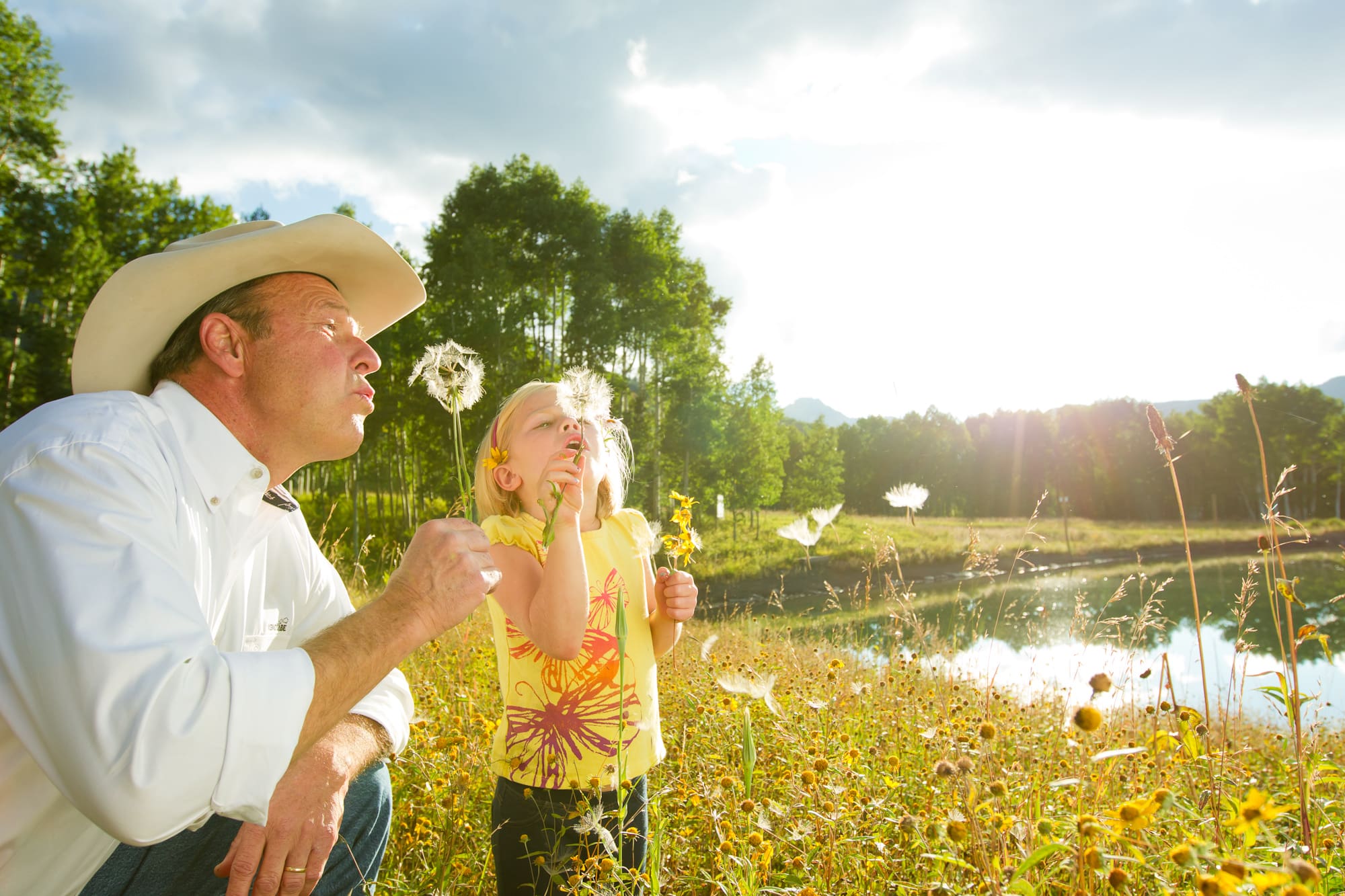 Family summer scene in flower meadow