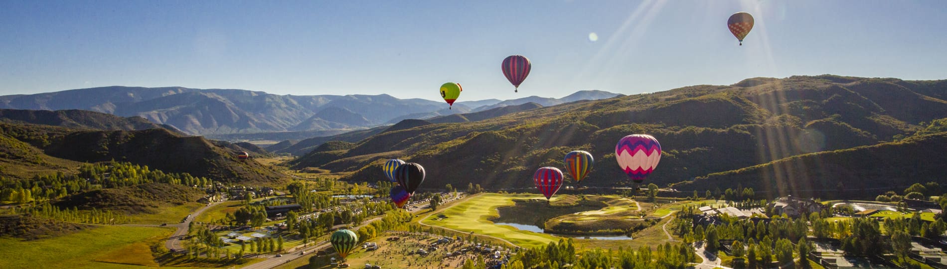 Snowmass Village Balloon Festival - Hot Air balloons flying over roarking fork valley