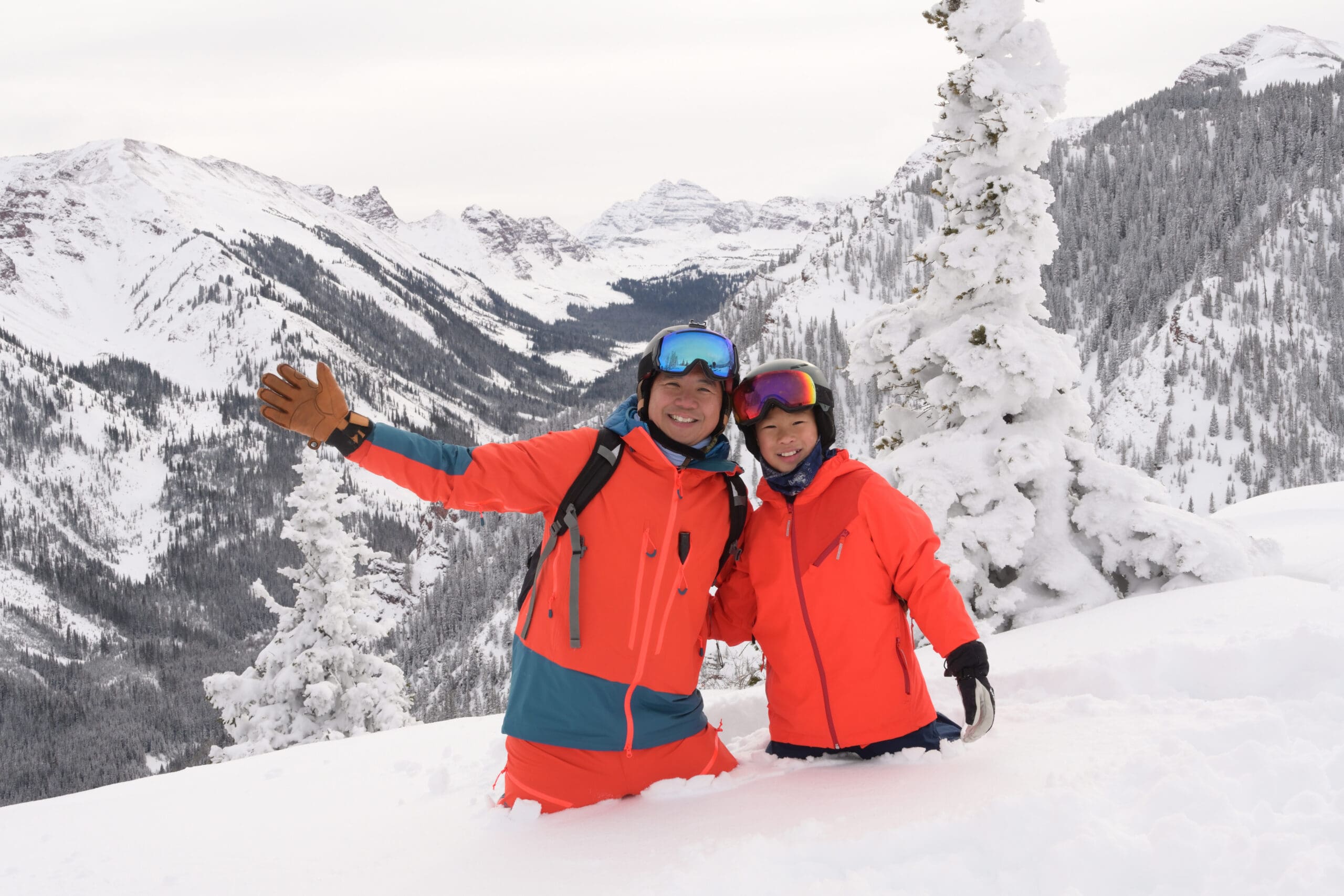 father and son enjoying a day on the mountain to ski in snowmass village